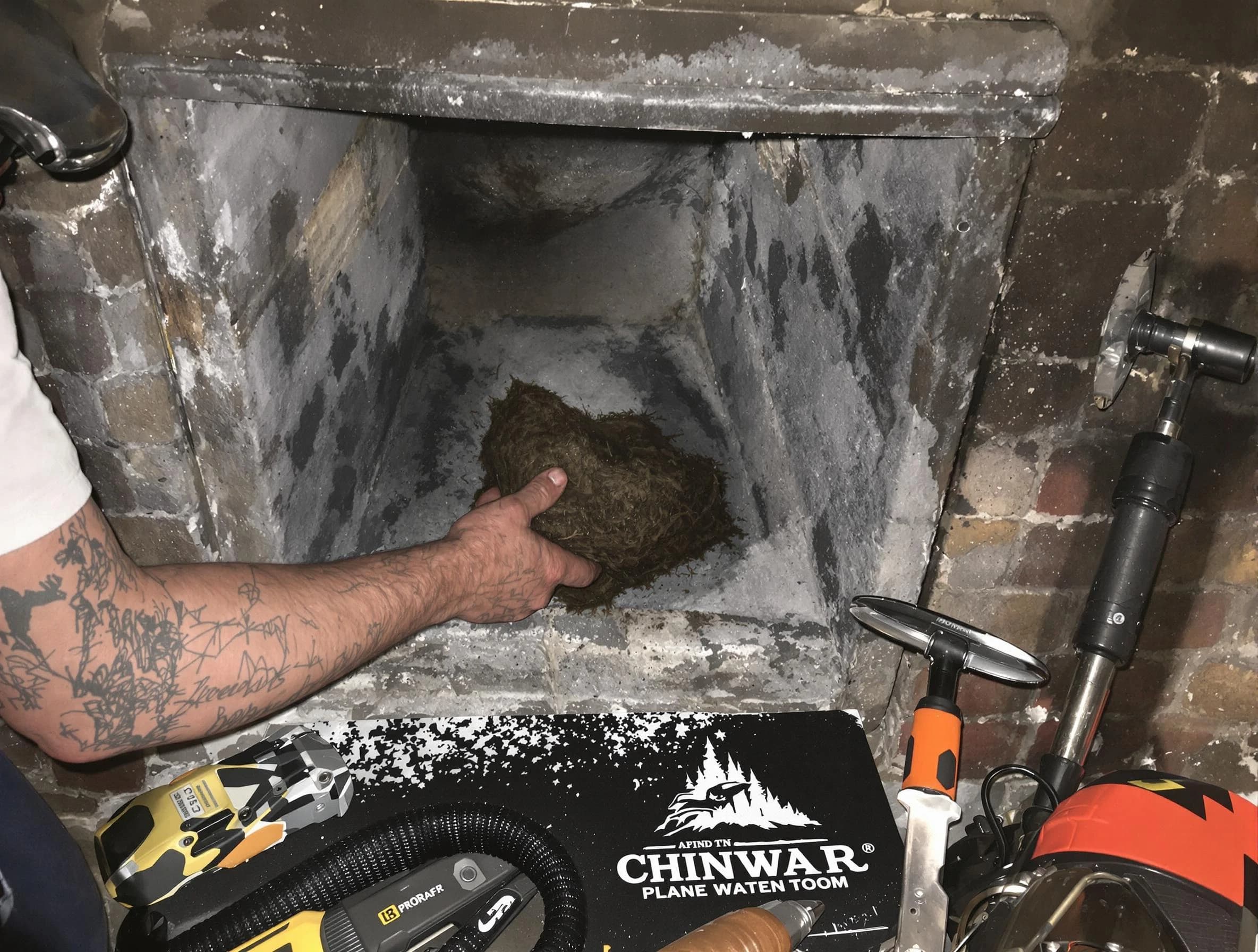 Buford Chimney Sweep safely removing debris and screening chimney in Buford, GA