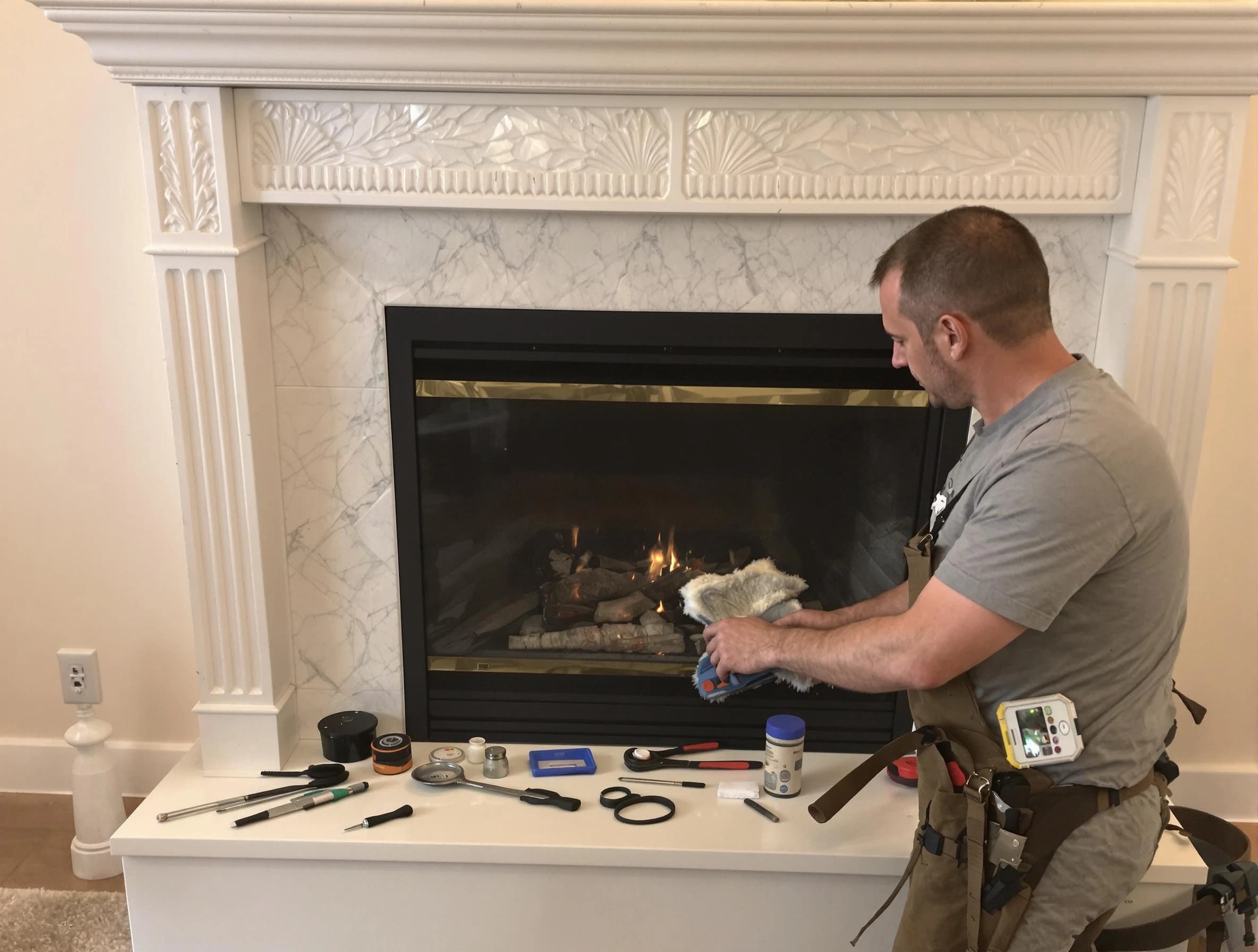 Buford Chimney Sweep performing fireplace maintenance in Buford, GA